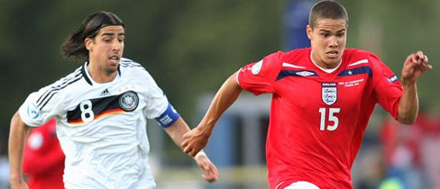 German skipper, Sami Khedira, in pursuit of England goalscorer, Jack Rodwell.